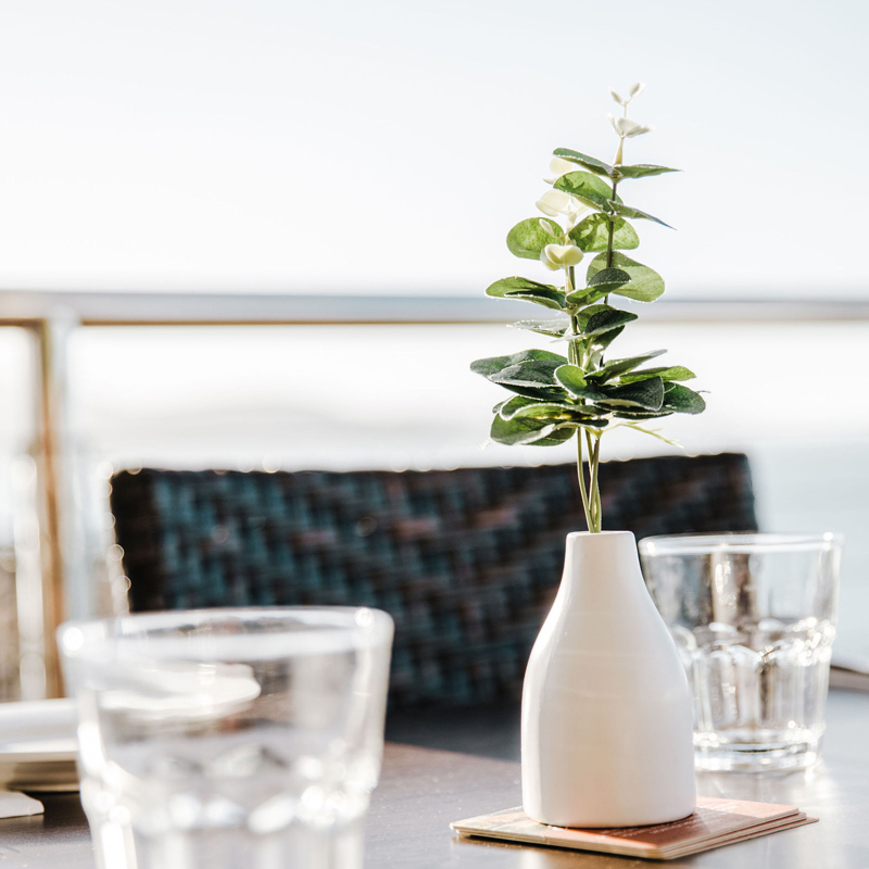 Prawn gambiri on serving platter wit bread and rocket